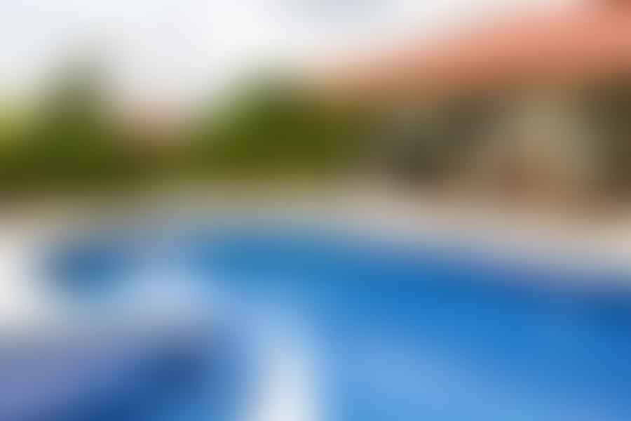 Professional pool inspector conducting a thorough pool inspection